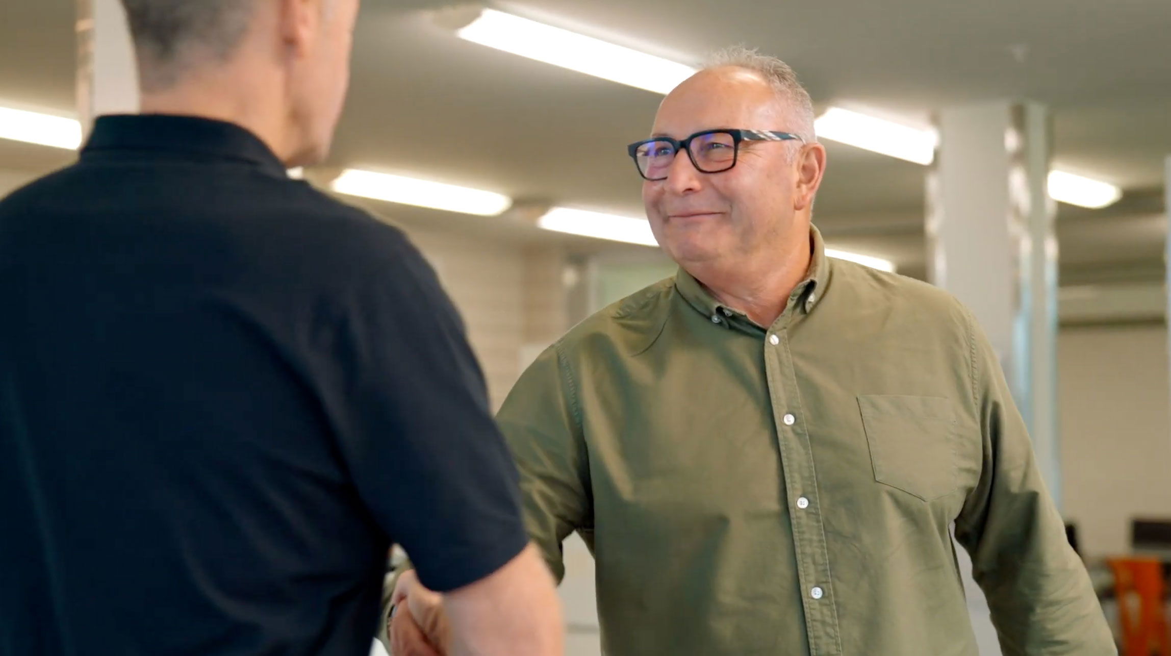 Image of two men shaking hands